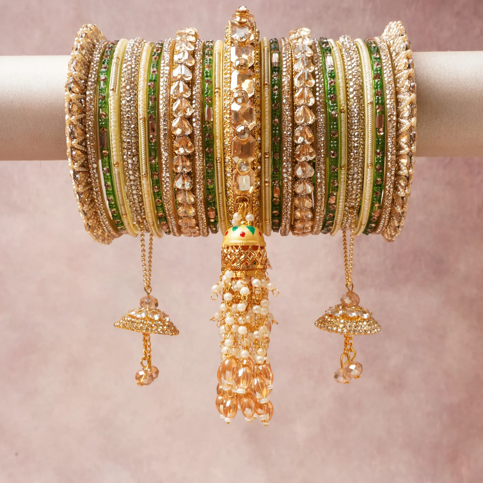 A commanding Gold anchors this beautiful set, enriched with accents of Emerald Green, Cream, Champagne that add depth and dimension.

Featuring a striking composition of Gold-toned Metal, Glass, Cubic Zirconia, Faux Pearls, Crystal, this set carries intricate craftsmanship and strong presence. Grand in form, it is created for moments that deserve to be marked.